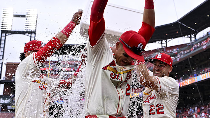 Mar 29, 2025; St. Louis, Missouri, USA;  St. Louis Cardinals left fielder Lars Nootbaar (21) is doused with water by shortstop Masyn Winn (0) and center fielder Michael Siani (22) after the Cardinals defeated the Minnesota Twins at Busch Stadium. Mandatory Credit: Jeff Curry-Imagn Images