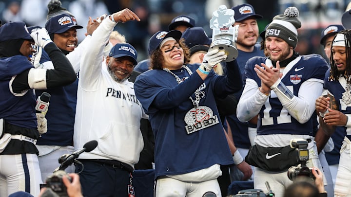 Penn State Nittany Lions wide receiver Trebor Pena (8) holds the David C. Koch MVP Trophy after defeating the Clemson Tigers in the 2025 Pinstripe Bowl at Yankee Stadium. 