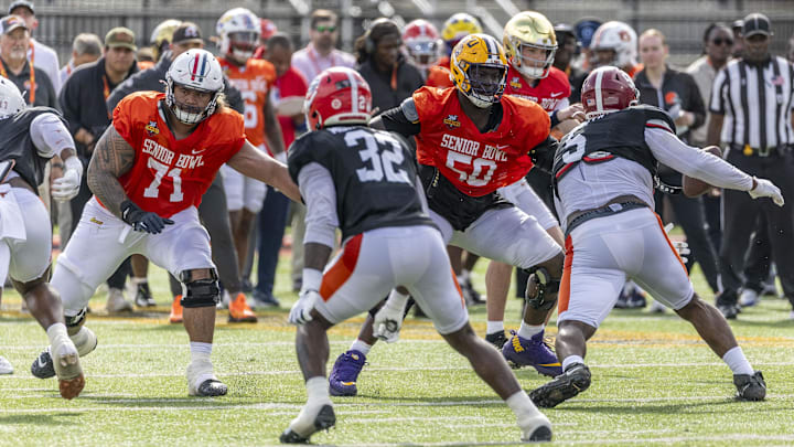 American team offensive lineman Jonah Savaiinaea of Arizona (71) and American team offensive lineman Emery Jones of LSU (50) drop into pass protection during Senior Bowl practice for the American team at Hancock Whitney Stadium last year.