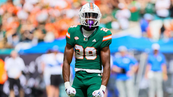 Nov 2, 2024; Miami Gardens, Florida, USA; Miami Hurricanes defensive back OJ Frederique Jr. (29) reacts after breaking pass  against the Duke Blue Devils during the first quarter at Hard Rock Stadium. Mandatory Credit: Sam Navarro-Imagn Images