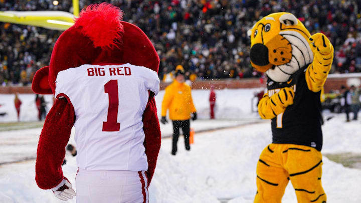 The Missouri Tigers mascot Truman and Arkansas Razorbacks mascot Big Red get into a snowball fight during the second half of the game at Faurot Field at Memorial Stadium. The Missouri Tigers mascot Truman and Arkansas Razorbacks mascot Big Red get into a snowball fight during the second half of the game at Faurot Field at Memorial Stadium.