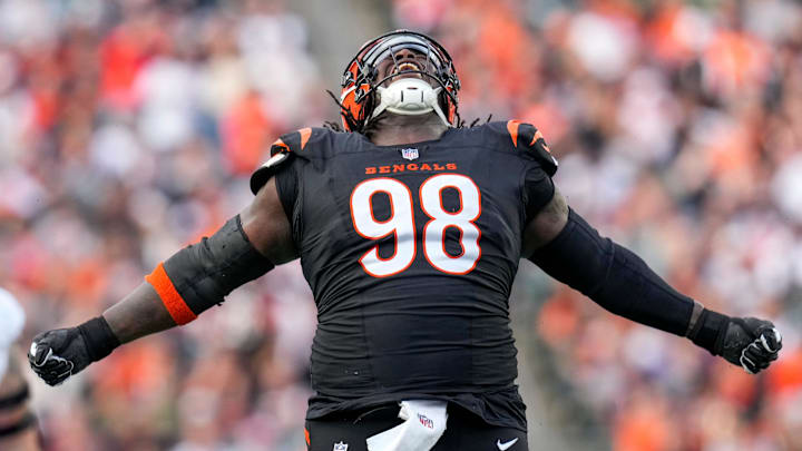 Cincinnati Bengals defensive tackle T.J. Slaton Jr. (98) celebrates after sacking Arizona Cardinals quarterback Jacoby Brissett (7) in the third quarter of the NFL Week 17 game between the Cincinnati Bengals and the Arizona Cardinals at Paycor Stadium in Downtown Cincinnati on Sunday, Dec. 28, 2025. The Bengals won 37-14.