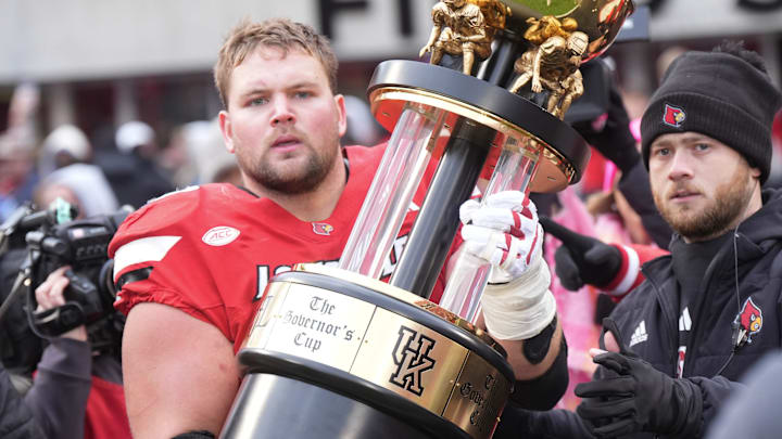 Louisville’s Pete Nygra carried the Governor’s Cup on to the field after defeating Kentucky in the Governor’s Cup.
November 29, 2025
