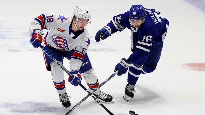 Rochester's Isak Rosen (18) and Toronto's William Villeneuve race for a loose puck. Rochester's Isak Rosen (18) and Toronto's William Villeneuve race for a loose puck.