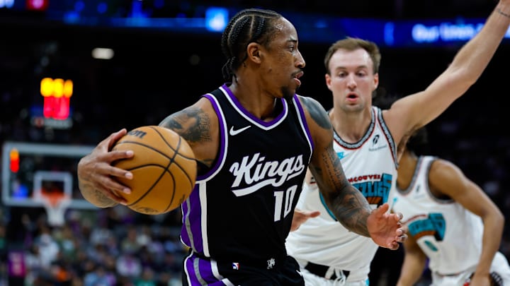 Mar 17, 2025; Sacramento, California, USA; Sacramento Kings forward DeMar DeRozan (10) dribbles the ball during the first quarter against Memphis Grizzlies guard Luke Kennard (10) at Golden 1 Center. Mandatory Credit: Sergio Estrada-Imagn Images