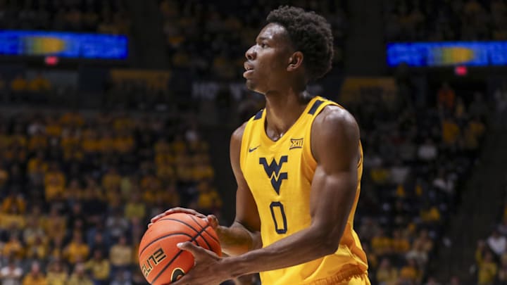 Jan 10, 2026; Morgantown, West Virginia, USA; West Virginia Mountaineers forward Brenen Lorient (0) shoots a three pointer during the second half against the Kansas Jayhawks at Hope Coliseum. Mandatory Credit: Ben Queen-Imagn Images