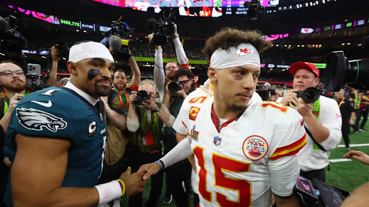 Philadelphia Eagles quarterback Jalen Hurts (1) shakes hands with Kansas City Chiefs quarterback Patrick Mahomes (15) after Super Bowl LIX at Ceasars Superdome. 