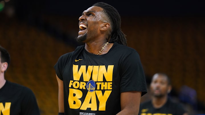 Kevon Looney warms up before a playoff game against the Timberwolves.
