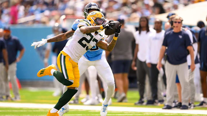 Green Bay Packers cornerback Jaire Alexander (23) intercepts a pass during the win at the Titans.