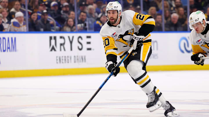 Mar 27, 2025; Buffalo, New York, USA;  Pittsburgh Penguins defenseman Conor Timmins (20) skates up ice with the puck during the first period against the Buffalo Sabres at KeyBank Center. Mandatory Credit: Timothy T. Ludwig-Imagn Images
