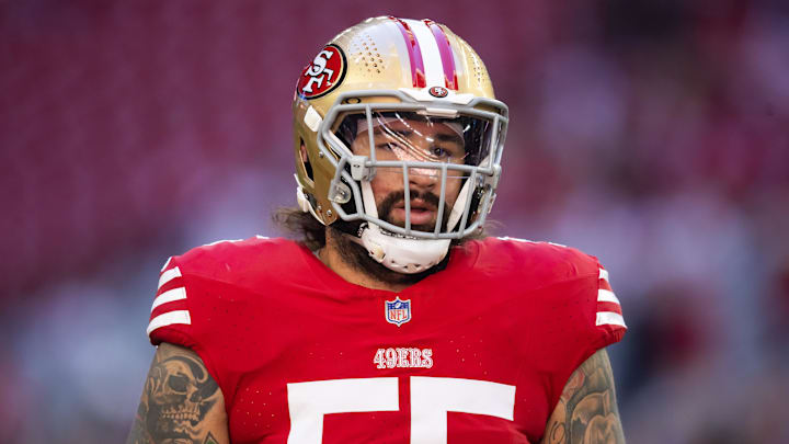 Dec 17, 2023; Glendale, Arizona, USA; San Francisco 49ers guard Jon Feliciano (55) against the Arizona Cardinals at State Farm Stadium. Mandatory Credit: Mark J. Rebilas-Imagn Images