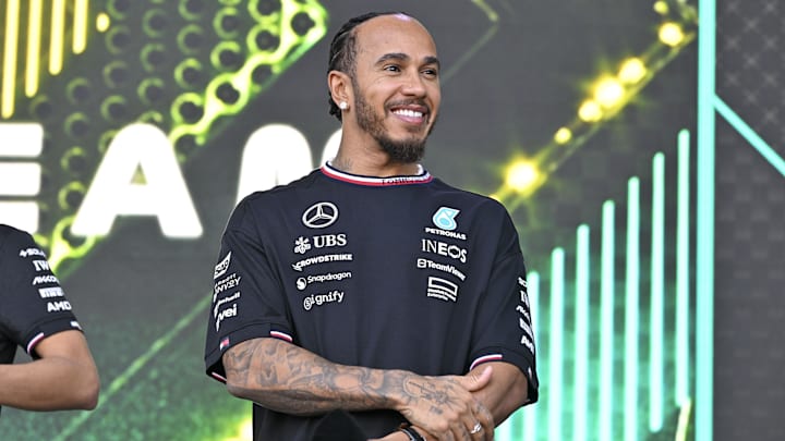 Oct 19, 2024; Austin, Texas, USA; Mercedes AMG Petronas F1 Team driver Lewis Hamilton (44) of Team Great Britain smiles to the crowd during a fan forum before the Sprint Race in the 2024 Formula One US Grand Prix at Circuit of the Americas. Mandatory Credit: Jerome Miron-Imagn Images