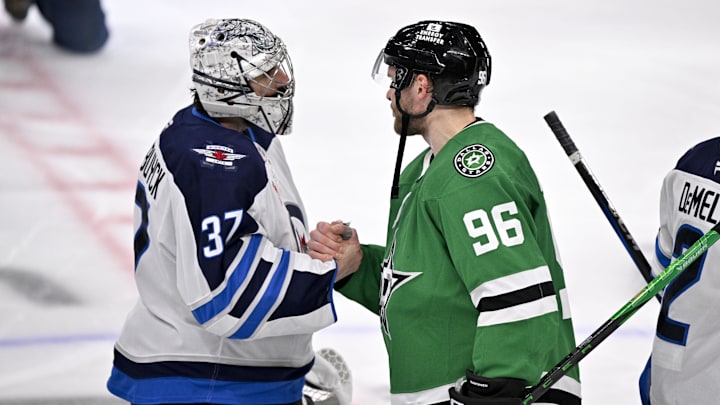 May 17, 2025; Dallas, Texas, USA; Winnipeg Jets goaltender Connor Hellebuyck (37) shakes hands with Dallas Stars right wing Mikko Rantanen (96) after the Stars defeat the Jets in the overtime period in game six of the second round of the 2025 Stanley Cup Playoffs at American Airlines Center. Mandatory Credit: Jerome Miron-Imagn Images
