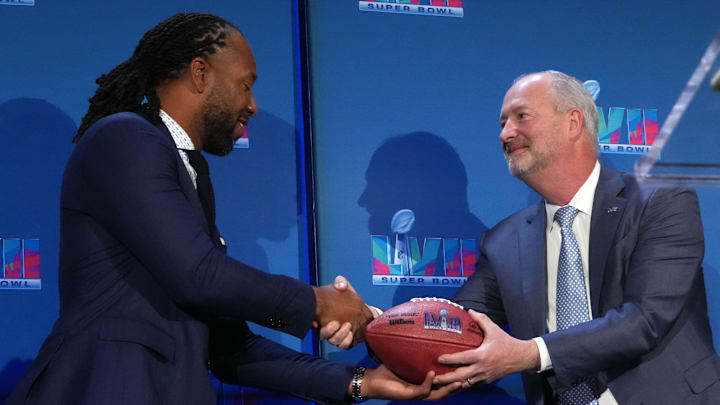 Feb 13, 2023; Phoenix, AZ, USA; Arizona Super Bowl 57 Host Committee executive chair Larry Fitzgerald (left) hands a Super Bowl 58 logo football to Las Vegas Super Bowl LVIII Executive Host Committee president Steve Hill during the Super Bowl Host Committee Handoff press conference at the Phoenix Convention Center. Mandatory Credit: Kirby Lee-Imagn Images Feb 13, 2023; Phoenix, AZ, USA; Arizona Super Bowl 57 Host Committee executive chair Larry Fitzgerald (left) hands a Super Bowl 58 logo football to Las Vegas Super Bowl LVIII Executive Host Committee president Steve Hill during the Super Bowl Host Committee Handoff press conference at the Phoenix Convention Center. Mandatory Credit: Kirby Lee-Imagn Images