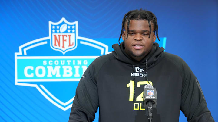 Michigan defensive lineman Kenneth Grant talks to reporters at the Scouting Combine.