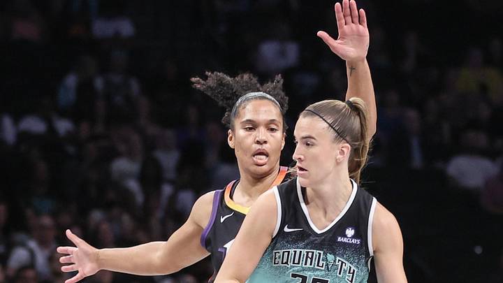 Jul 25, 2025; Brooklyn, New York, USA;  New York Liberty guard Sabrina Ionescu (20) looks to drive past Phoenix Mercury forward Alyssa Thomas (25) in the first quarter at Barclays Center. Mandatory Credit: Wendell Cruz-Imagn Images