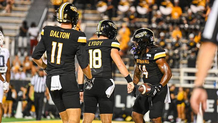 Southern Miss quarterback Landry Lyddy (18) with teammates Davis Dalton (11) and Steven Robinson (14) during Saturday's game against UConn at The Rock. Southern Miss quarterback Landry Lyddy (18) with teammates Davis Dalton (11) and Steven Robinson (14) during Saturday's game against UConn at The Rock.