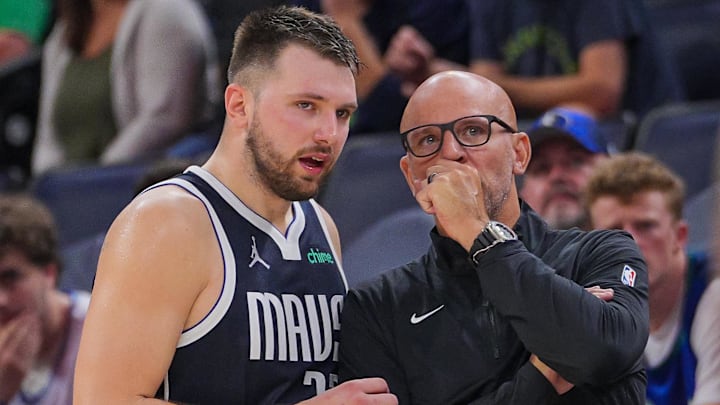 Oct 29, 2024; Minneapolis, Minnesota, USA; Dallas Mavericks guard Luka Doncic (left) and head coach Jason Kidd talk during the game against the Minnesota Timberwolves in the fourth quarter at Target Center. Mandatory Credit: Brad Rempel-Imagn Images