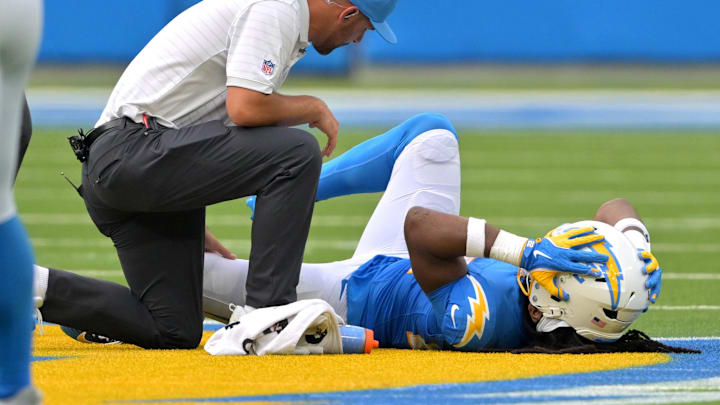 Sep 21, 2025; Inglewood, California, USA; Los Angeles Chargers medical staff check on running back Najee Harris (22) after an injury in the first half against the Denver Broncos at SoFi Stadium. Mandatory Credit: Jayne Kamin-Oncea-Imagn Images Sep 21, 2025; Inglewood, California, USA; Los Angeles Chargers medical staff check on running back Najee Harris (22) after an injury in the first half against the Denver Broncos at SoFi Stadium. Mandatory Credit: Jayne Kamin-Oncea-Imagn Images