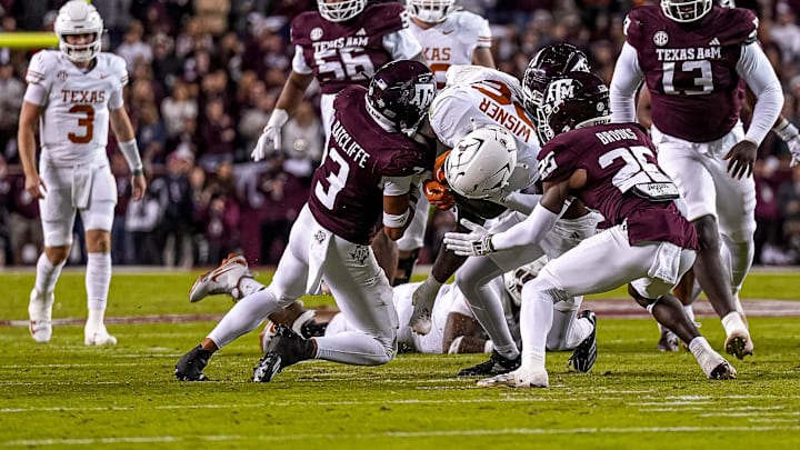 Texas Longhorns running back Quintrevion Wisner (26) runs the ball during the Lone Star Showdown against the Texas A&M Aggies at Kyle Field on Saturday, Nov. 30, 2024 in College Station, Texas.