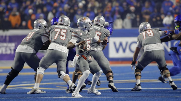UNLV Rebels quarterback Hajj-Malik Williams (6) throws down field during the second half against the Boise State Broncos at Albertsons Stadium. Boise State beats  UNLV 21-7. 