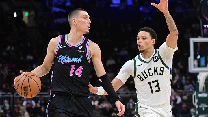 Feb 24, 2026; Milwaukee, Wisconsin, USA;  Miami Heat guard Tyler Herro (14) looks for a shot against Milwaukee Bucks guard Ryan Rollins (13) in the fourth quarter at Fiserv Forum. Mandatory Credit: Benny Sieu-Imagn Images