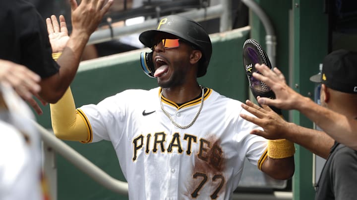 Jul 24, 2024; Pittsburgh, Pennsylvania, USA;  Pittsburgh Pirates left fielder Joshua Palacios (77) celebrates in the dugout after scoring a run against the St. Louis Cardinals during the second inning at PNC Park. Mandatory Credit: Charles LeClaire-Imagn Images