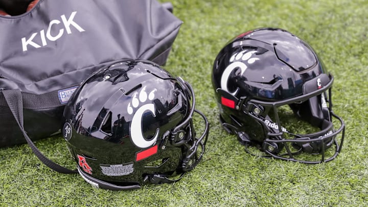 Oct 30, 2021; New Orleans, Louisiana, USA;  Cincinnati Bearcats helmets on the ground during the game against Tulane Green Wave during the second half at Yulman Stadium. Mandatory Credit: Stephen Lew-Imagn Images