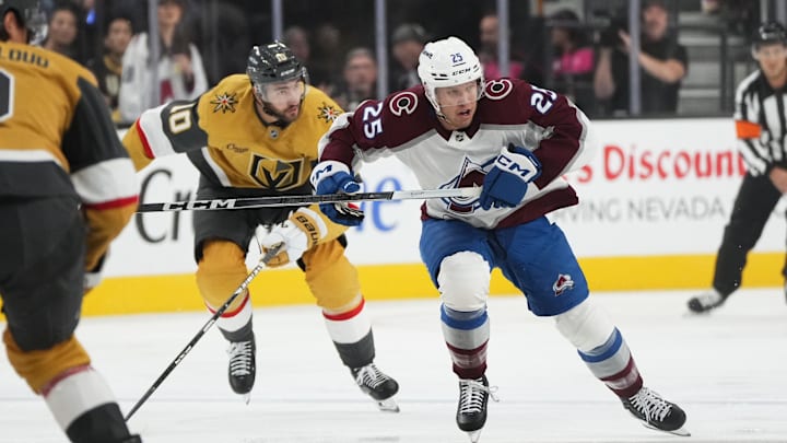 Oct 9, 2024; Las Vegas, Nevada, USA; Colorado Avalanche right wing Logan O’Connor (25) skates ahead of Vegas Golden Knights center Nicolas Roy (10) during the first period at T-Mobile Arena. Mandatory Credit: Lucas Peltier-Imagn Images