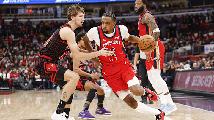 Dec 14, 2025; Chicago, Illinois, USA; New Orleans Pelicans forward Herbert Jones (2) drives to the basket against Chicago Bulls forward Matas Buzelis (14) during the second half at United Center. Mandatory Credit: Kamil Krzaczynski-Imagn Images Dec 14, 2025; Chicago, Illinois, USA; New Orleans Pelicans forward Herbert Jones (2) drives to the basket against Chicago Bulls forward Matas Buzelis (14) during the second half at United Center. Mandatory Credit: Kamil Krzaczynski-Imagn Images