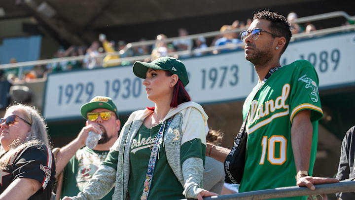 Sep 26, 2024; Oakland, California, USA; Oakland Athletics fans look on during pregame ceremonies before the game against the Texas Rangers at Oakland-Alameda County Coliseum. Mandatory Credit: Ed Szczepanski-Imagn Images