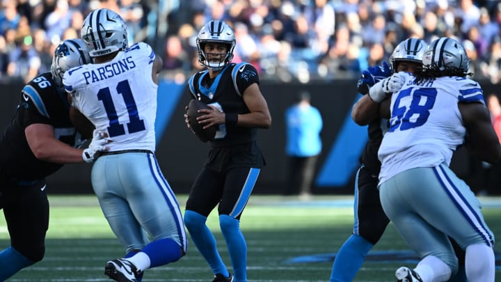 Nov 19, 2023; Charlotte, North Carolina, USA; Carolina Panthers quarterback Bryce Young (9) looks to pass as Dallas Cowboys linebacker Micah Parsons (11) and defensive tackle Mazi Smith (58) defend in the third quarter at Bank of America Stadium. Mandatory Credit: Bob Donnan-USA TODAY Sports Nov 19, 2023; Charlotte, North Carolina, USA; Carolina Panthers quarterback Bryce Young (9) looks to pass as Dallas Cowboys linebacker Micah Parsons (11) and defensive tackle Mazi Smith (58) defend in the third quarter at Bank of America Stadium. Mandatory Credit: Bob Donnan-USA TODAY Sports
