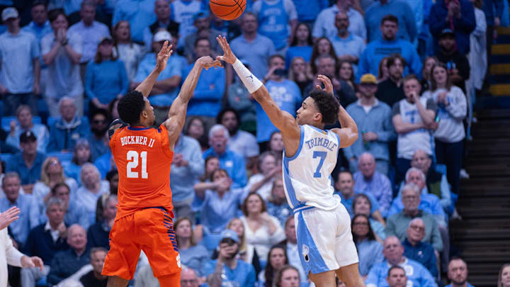 Mar 3, 2026; Chapel Hill, North Carolina, USA; Clemson Tigers guard Ace Buckner (21) shoots the ball over North Carolina Tar Heels guard Seth Trimble (7) during the second half at Dean E. Smith Center. Mandatory Credit: Scott Kinser-Imagn Images