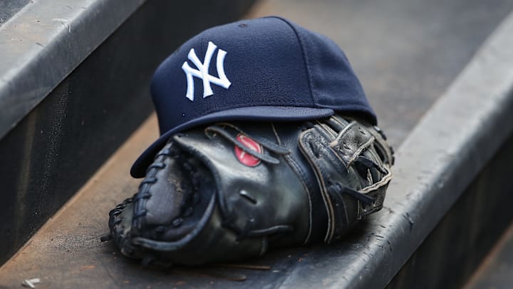 Jul 24, 2013; Arlington, TX, USA; New York Yankees hat and glove sit on the dugout steps during the game against the Texas Rangers at Rangers Ballpark in Arlington. Texas won 3-1. Mandatory Credit: Kevin Jairaj-Imagn Images Jul 24, 2013; Arlington, TX, USA; New York Yankees hat and glove sit on the dugout steps during the game against the Texas Rangers at Rangers Ballpark in Arlington. Texas won 3-1. Mandatory Credit: Kevin Jairaj-Imagn Images
