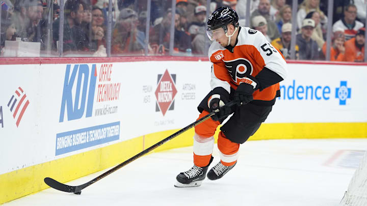 Feb 28, 2026; Philadelphia, Pennsylvania, USA; Philadelphia Flyers defenseman Rasmus Ristolainen (55) controls the puck against the Boston Bruins in the first period at Xfinity Mobile Arena.