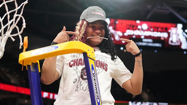 Apr 7, 2024; Cleveland, OH, USA; South Carolina Gamecocks guard Te-Hina Paopao (0) cuts down the net after defeating the Iowa Hawkeyes in the finals of the Final Four of the womens 2024 NCAA Tournament at Rocket Mortgage FieldHouse. Mandatory Credit: Kirby Lee-Imagn Images