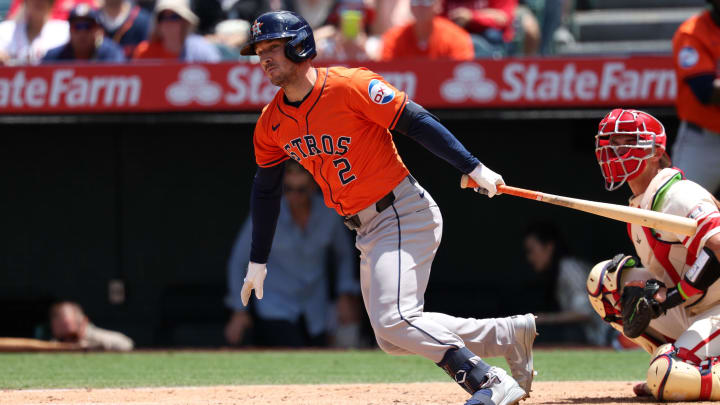 Jun 9, 2024; Anaheim, California, USA;  Houston Astros third baseman Alex Bregman (2) hits an RBI double during the third inning against the Los Angeles Angels at Angel Stadium