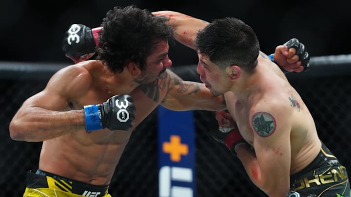 Jul 8, 2023; Las Vegas, Nevada, USA; Brandon Moreno (red gloves) fights Alexandre Pantoja (blue