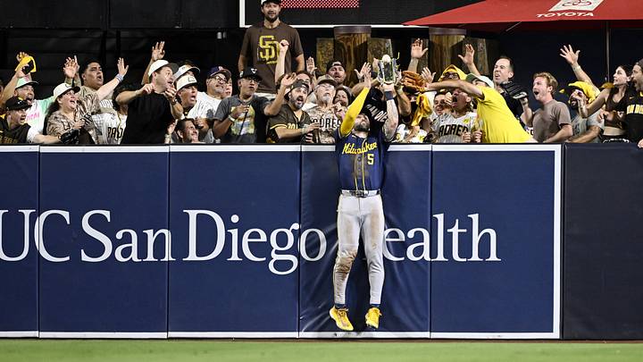 Oct 7, 2026; San Diego, California, USA; Milwaukee Brewers center fielder Garrett Mitchell (5) catches a ball hit by San Diego Padres third baseman Manny Machado (not pictured) at the wall during the eighth inning in game four of the NLDS for the 2026 MLB Playoffs at Petco Park. Mandatory Credit: Denis Poroy-Imagn Images Oct 7, 2026; San Diego, California, USA; Milwaukee Brewers center fielder Garrett Mitchell (5) catches a ball hit by San Diego Padres third baseman Manny Machado (not pictured) at the wall during the eighth inning in game four of the NLDS for the 2026 MLB Playoffs at Petco Park. Mandatory Credit: Denis Poroy-Imagn Images