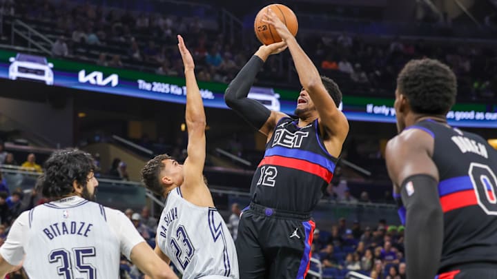 Nov 23, 2024; Orlando, Florida, USA; Detroit Pistons forward Tobias Harris (12) shoots the ball over Orlando Magic forward Tristan da Silva (23) during the first quarter at Kia Center. Mandatory Credit: Mike Watters-Imagn Images