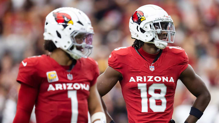 Sep 29, 2024; Glendale, Arizona, USA; Arizona Cardinals wide receiver Marvin Harrison Jr. (18) alongside quarterback Kyler Murray (1) against the Washington Commanders in the first half at State Farm Stadium. Mandatory Credit: Mark J. Rebilas-Imagn Images Sep 29, 2024; Glendale, Arizona, USA; Arizona Cardinals wide receiver Marvin Harrison Jr. (18) alongside quarterback Kyler Murray (1) against the Washington Commanders in the first half at State Farm Stadium. Mandatory Credit: Mark J. Rebilas-Imagn Images