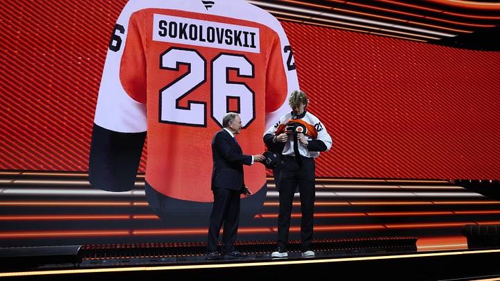 Jun 26, 2026; Buffalo, New York, USA; Maksim Sokolovskii reacts beside NHL commissioner Gary Bettman after being selected with the twenty seventh pick in the first round of the 2026 NHL Draft by the Philadelphia Flyers at KeyBank Center. Mandatory Credit: Timothy T. Ludwig-Imagn Images