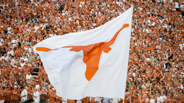 The Texas Longhorns logo flag flies during the game between the Texas Longhorns and the Notre Dame Fighting Irish at Darrell K. Royal-Texas Memorial Stadium. Texas won 50-47 in double overtime. The Texas Longhorns logo flag flies during the game between the Texas Longhorns and the Notre Dame Fighting Irish at Darrell K. Royal-Texas Memorial Stadium. Texas won 50-47 in double overtime.