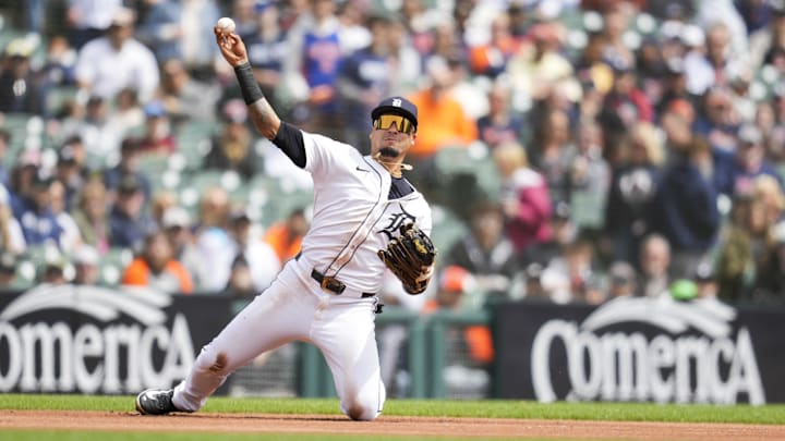Apr 20, 2025; Detroit, Michigan, USA; Detroit Tigers third baseman Javier Baez (28) fields and throws out Kansas City Royals first baseman Salvador Perez (13) in the first inning at Comerica Park. Mandatory Credit: Aaron Doster-Imagn Images
