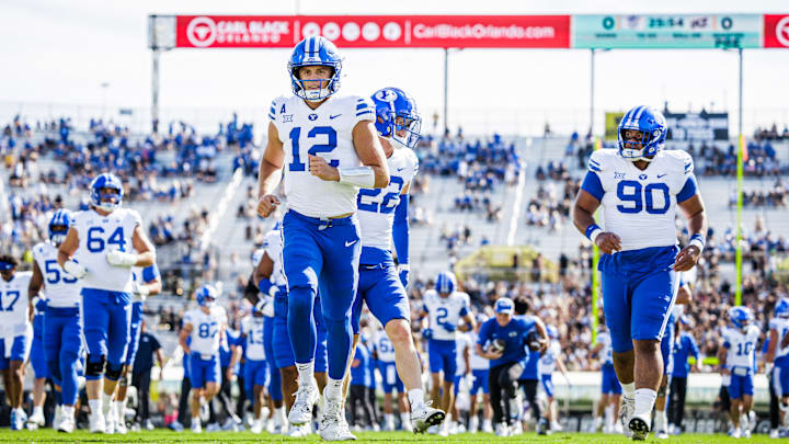 BYU quarterback Jake Retzlaff warms up before UCF game