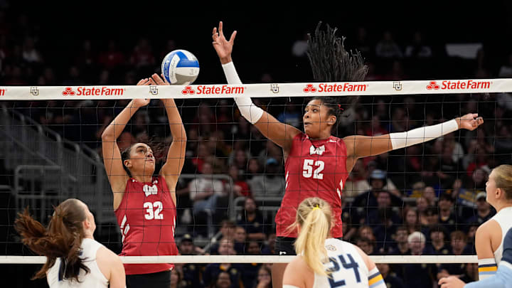 Wisconsin Badgers outside hitter Grace Egan (32) and middle blocker Carter Booth (52) jump to block the hit during the first set of the match against the Marquette Golden Eagles on Wednesday September 17, 2025 at Fiserv Forum in Milwaukee, Wisconsin. Wisconsin Badgers outside hitter Grace Egan (32) and middle blocker Carter Booth (52) jump to block the hit during the first set of the match against the Marquette Golden Eagles on Wednesday September 17, 2025 at Fiserv Forum in Milwaukee, Wisconsin.