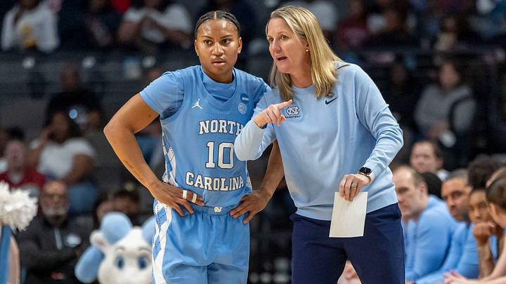 North Carolina Tar Heels head coach Courtney Banghart works with guard Reniya Kelly