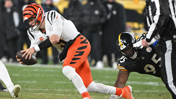 Jan 4, 2025; Pittsburgh, Pennsylvania, USA; Pittsburgh Steelers defensive tackle Keeanu Benton (95) tackles Cincinnati Bengals quarterback Joe Burrow (9) during the fourth quarter at Acrisure Stadium. Mandatory Credit: Barry Reeger-Imagn Images Jan 4, 2025; Pittsburgh, Pennsylvania, USA; Pittsburgh Steelers defensive tackle Keeanu Benton (95) tackles Cincinnati Bengals quarterback Joe Burrow (9) during the fourth quarter at Acrisure Stadium. Mandatory Credit: Barry Reeger-Imagn Images