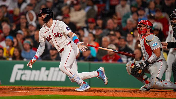 May 12, 2026; Boston, Massachusetts, USA; Boston Red Sox shortstop Trevor Story (10) hits a single against the Philadelphia Phillies in the seventh inning at Fenway Park. Mandatory Credit: David Butler II-Imagn Images