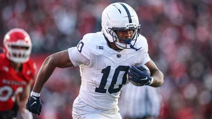 Nov 29, 2025; Piscataway, New Jersey, USA; Penn State Nittany Lions running back Nicholas Singleton (10) carries the ball against the Rutgers Scarlet Knights during the first half at SHI Stadium. Mandatory Credit: Vincent Carchietta-Imagn Images